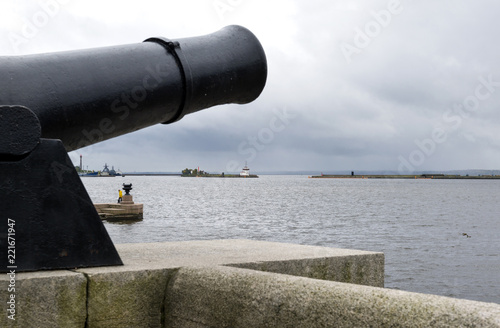 metal old gun over the Bay in Kronstadt, St. Petersburg, Gulf of Finland, Russia