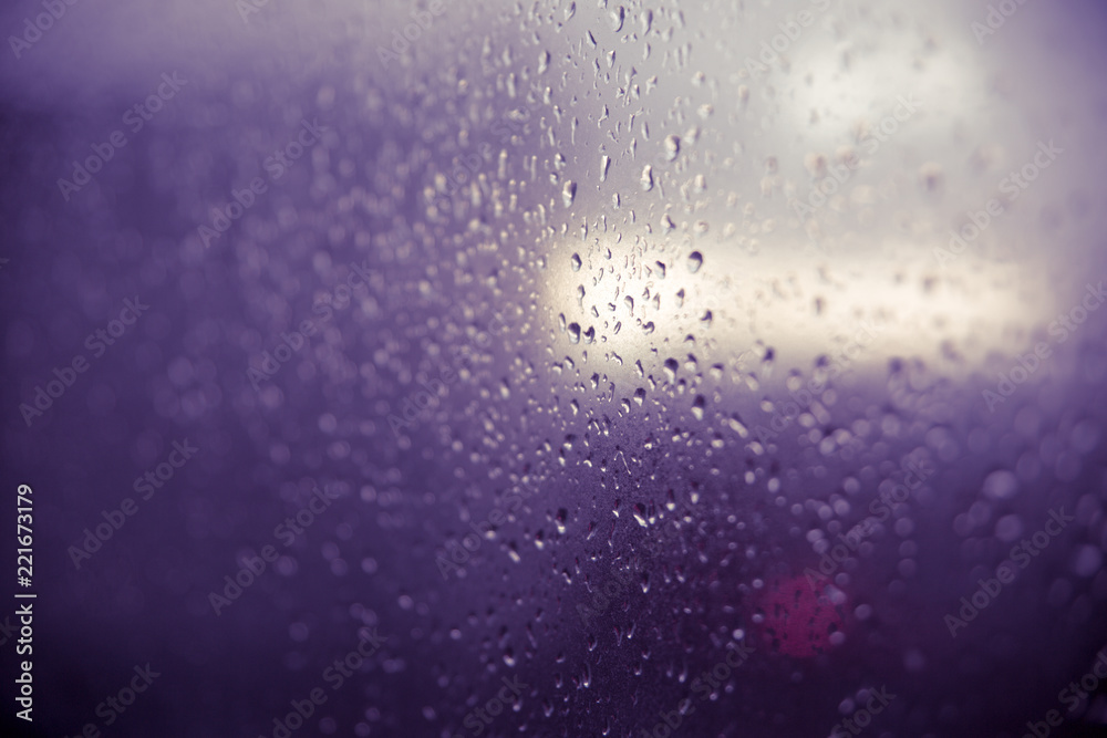 Raindrop on glass window, violet. Raindrop on glass window, violet.