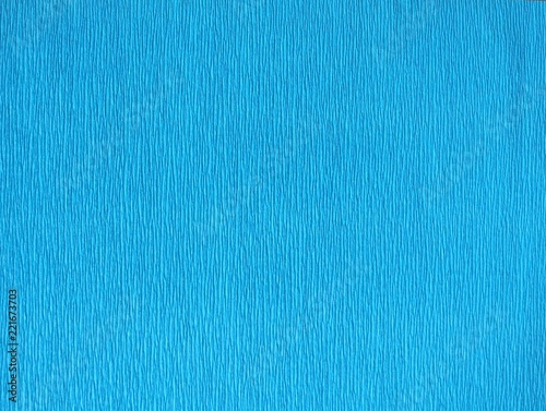 Bright blue crepe paper vertical lines background photo