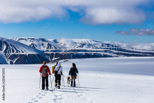 Snowshoeing with a husky in Svalbard photo