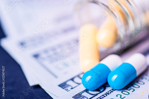 Medicine pills or capsules with money