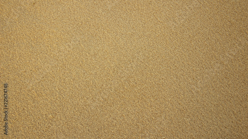 Textural background of small wooden sawdust of yellow color.