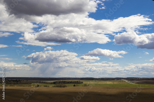 Rural landscape with storm clouds, dramatic sky © yauhenka