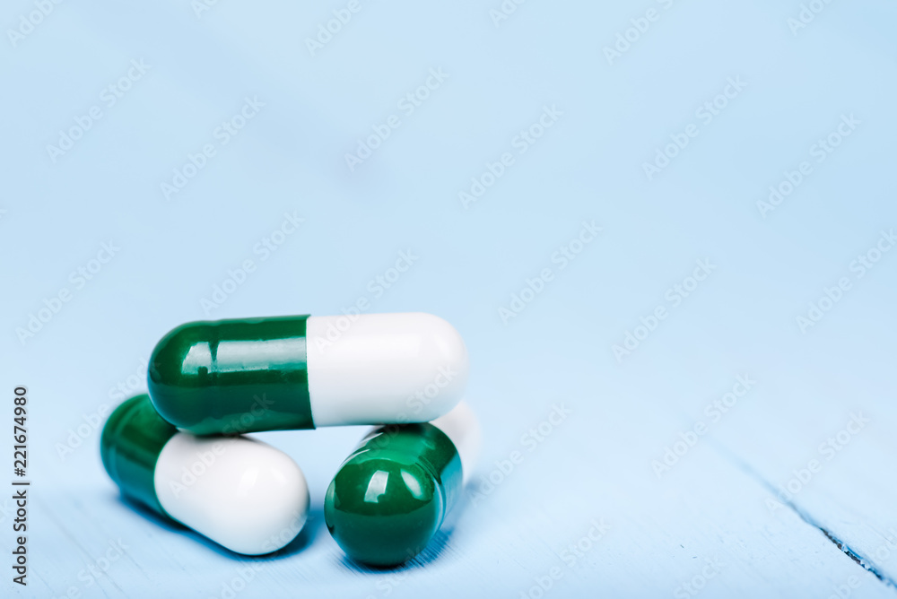 Medicine green and yellow pills or capsules Medicine green and yellow pills or capsules