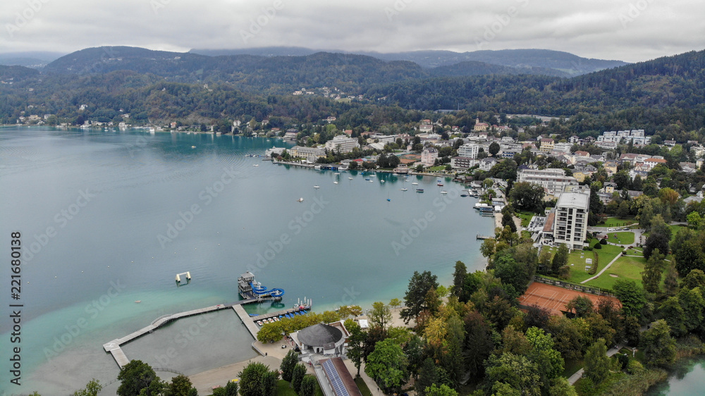 Fototapeta premium Aerial view of Portschach Am Worthersee small town on beautiful lake Worthersee in Austria