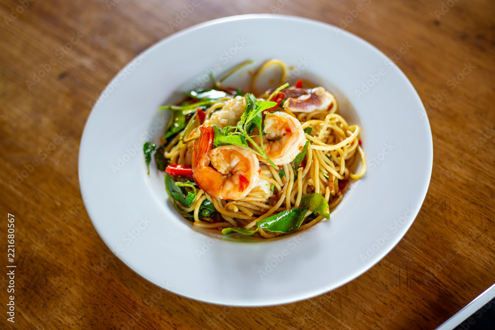 Spicy spaghetti with Seafood on a plate. selective focus.