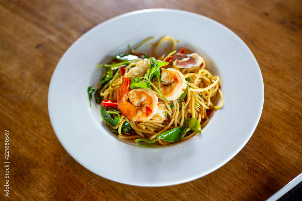 Spicy spaghetti with Seafood on a plate. selective focus. Spicy spaghetti with Seafood on a plate. selective focus.