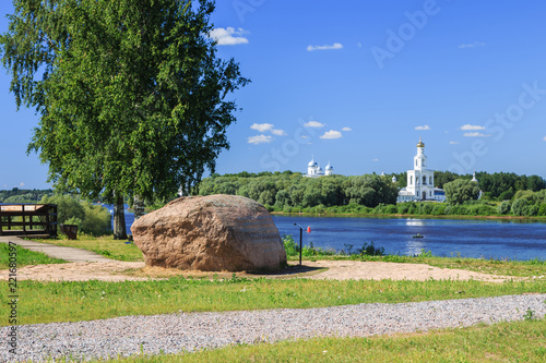 Veliky Novgorod, Russia. Rurik Settlement (Rurik Gorodishche), the archaeological monument of the IX century. On the horizon the ancient Yuryev monastery. photo