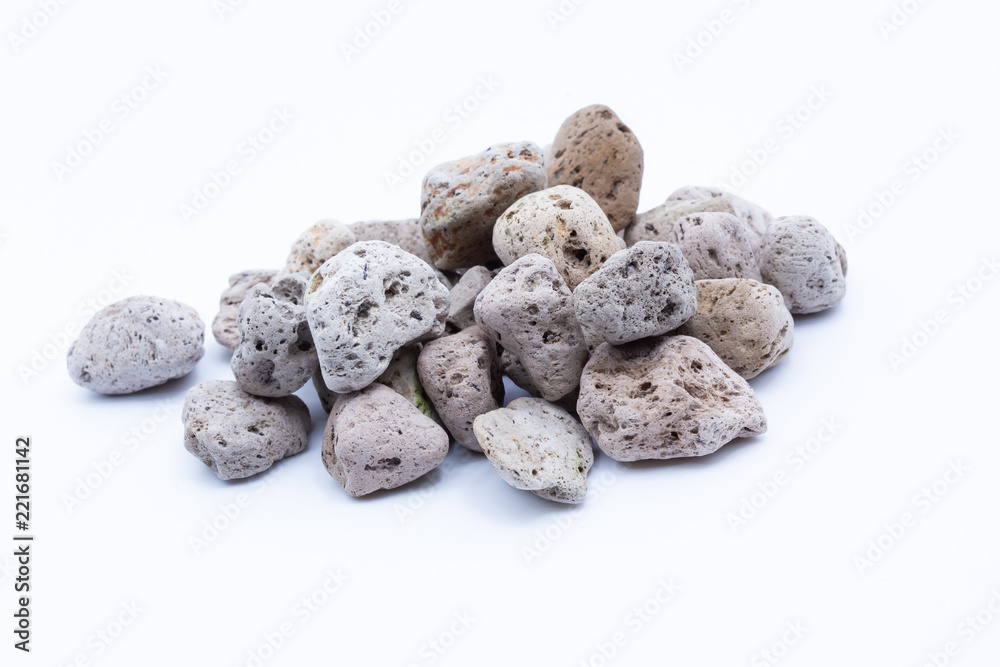 A natural piece of pumice stone isolated on white background. A natural piece of pumice stone isolated on white background.