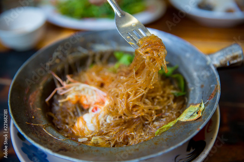 prawns ovened cellophane noodle or glass noodles and herbs. Chinese food in Thai style.Thai famous local food. Thai recommend menu for tourist photo