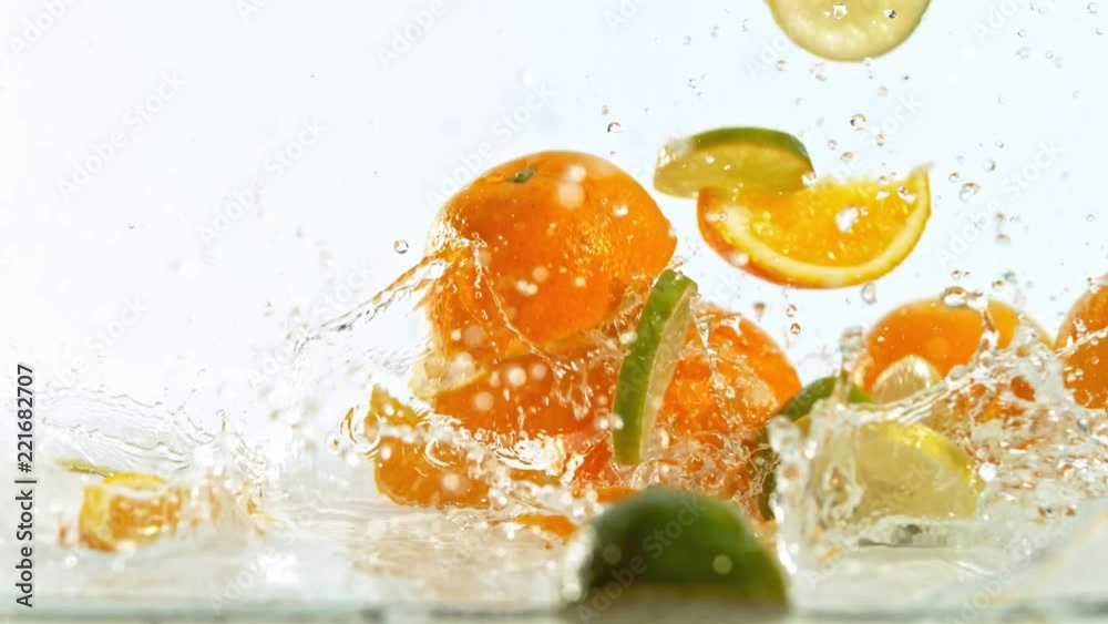 Fresh citruses dropped into water with splash, shooted with high speed cinema camera at 1000 fps. 4K footage.