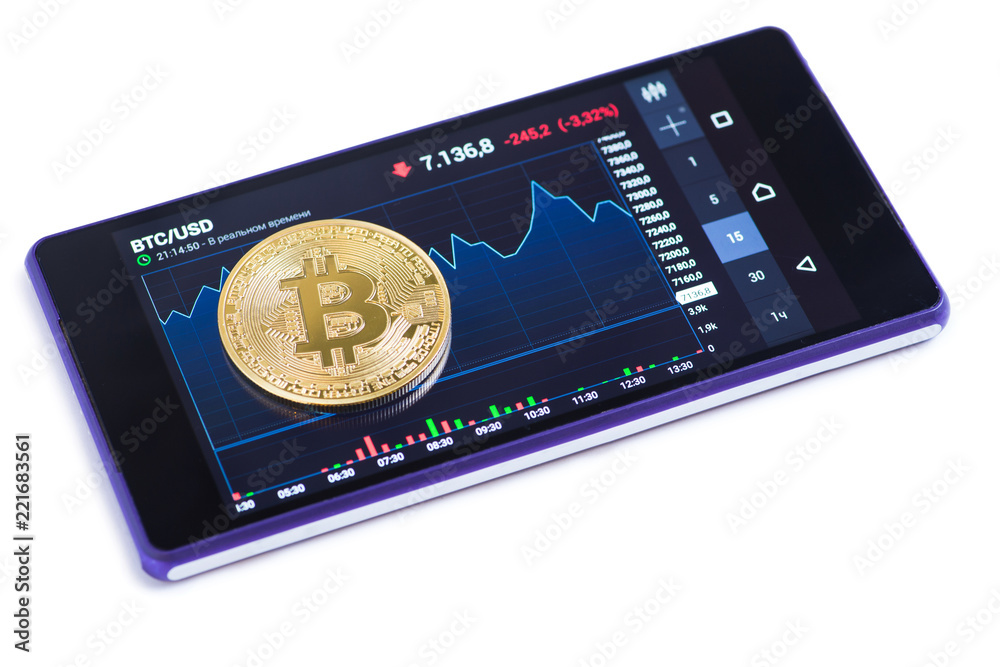 Golden bitcoin against currency chart on smartphone Golden bitcoin against currency chart on smartphone