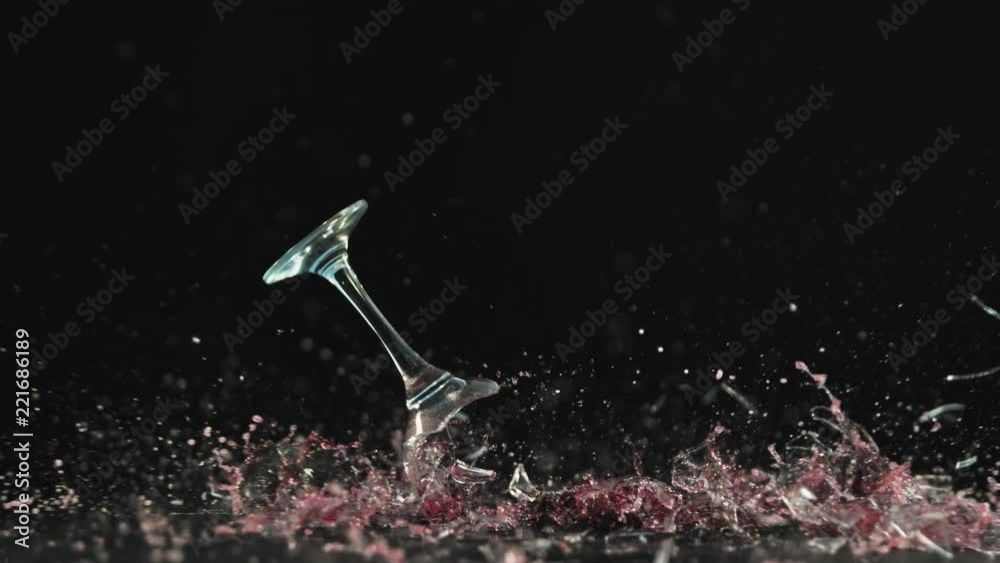Breaking wine glass on black background, shooted with high speed cinema camera at 1000 fps. 4K footage.