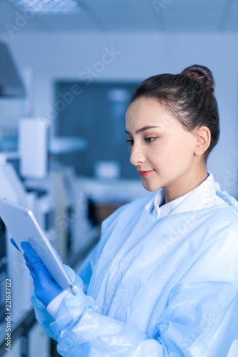 Female scientists are analyzing instrument data