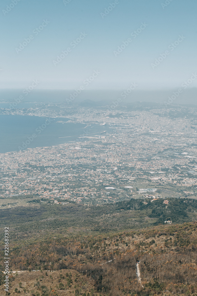 Vesuvius volcano in Italy. Top of the mountain, view of the crater and the surrounding area. High view, Naples and Pompeii below. The nature around the volcano