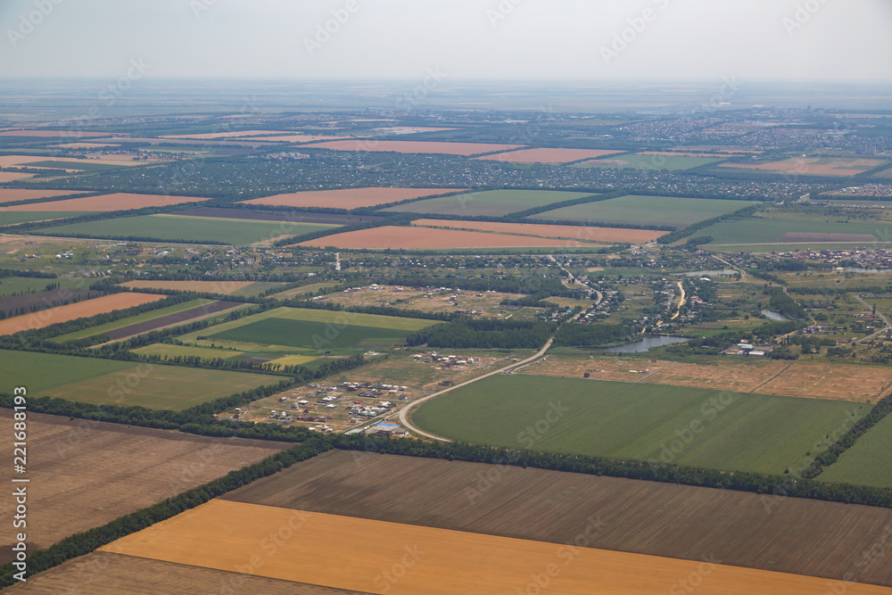 Several villages, a river, fields sown with wheat from a bird's eye view