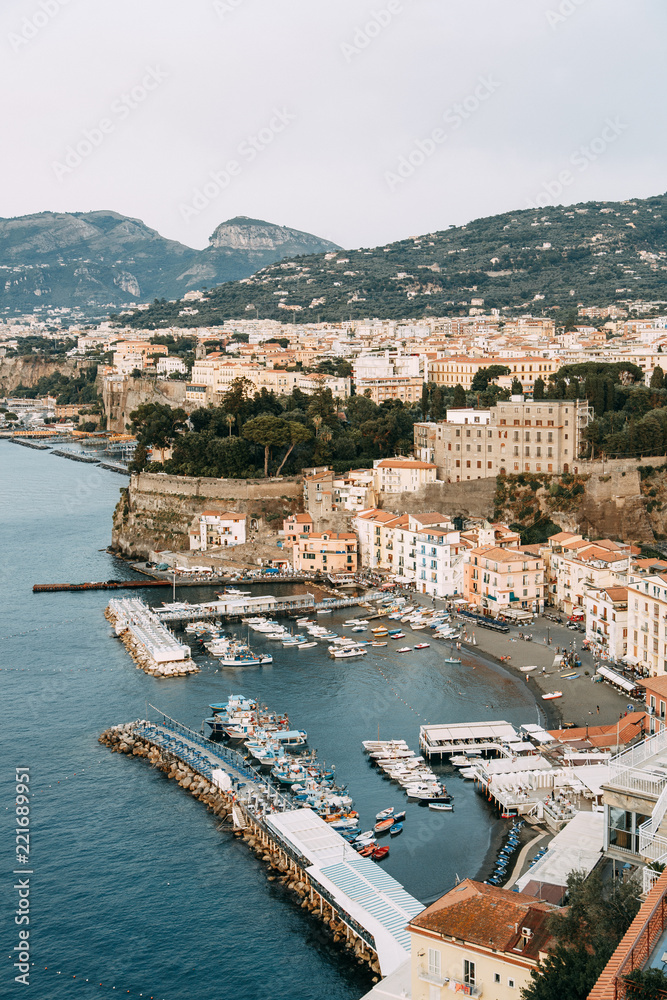 Views of the city of Sorrento in Italy, panorama and top view. Night and day, the streets and the coast. Beautiful landscape and brick roofs. Architecture and monuments of antiquity. 