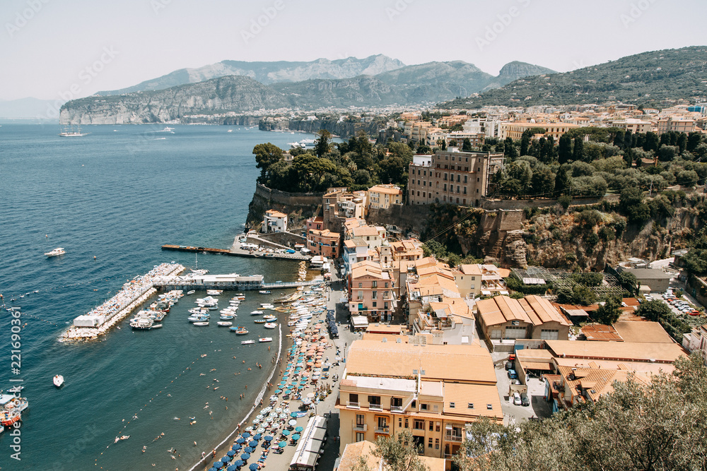 Views of the city of Sorrento in Italy, panorama and top view. Night and day, the streets and the coast. Beautiful landscape and brick roofs. Architecture and monuments of antiquity.