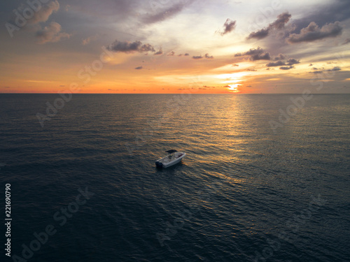 Lonely boat in the middle of the sea photo