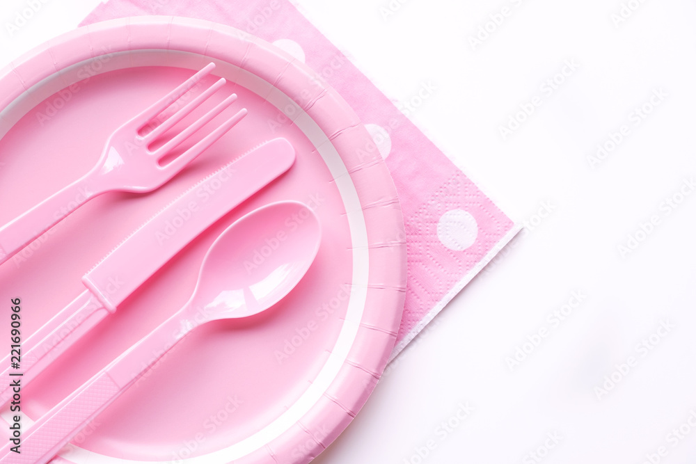 Pink color paper plate with plastic spoon, fork and knife for children