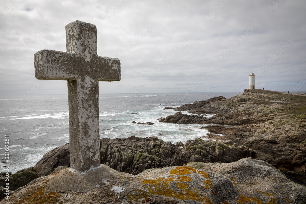 memorial cross for lost fishermen on Cape Roncudo (Faro de Cabo Roncudo) on the coast of death (costa da more ) in galicia, spain memorial cross for lost fishermen on Cape Roncudo (Faro de Cabo Roncudo) on the coast of death (costa da more ) in galicia, spain