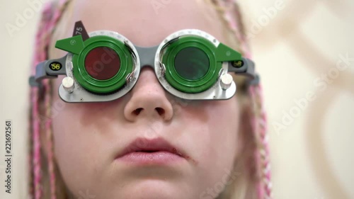Eyesight check. Caucasian girl who have vision disabilities.Medical treatment and Rehabilitation