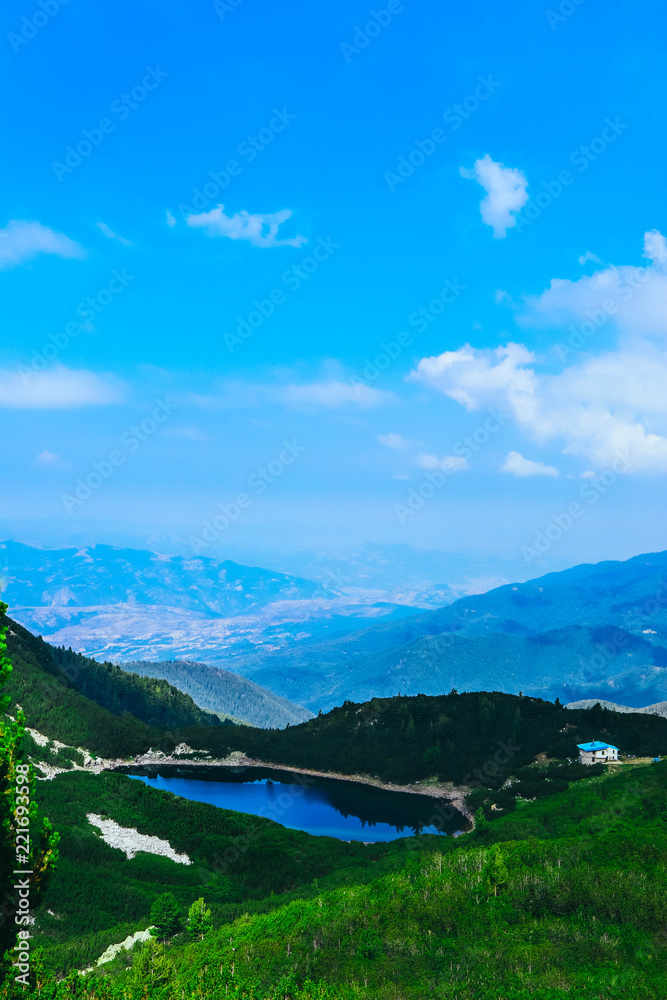Amazing alpine mountain landscape, cottage and lake. Europe, Bulgaria, Pirin mountains.