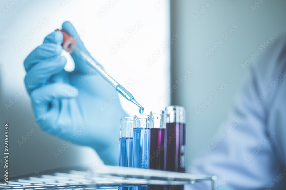 Scientist with equipment holding tools during scientific experiment science concept Scientist with equipment holding tools during scientific experiment science concept