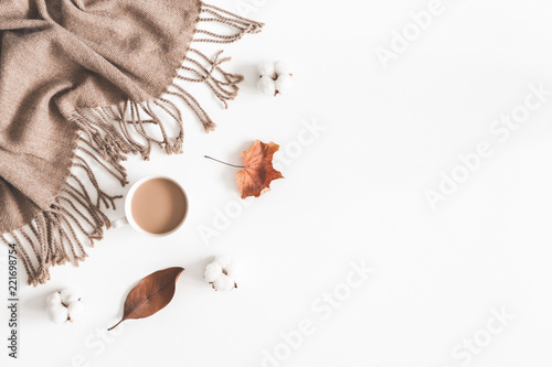 Autumn composition. Cup of coffee, plaid, dried leaves on white background. Autumn, fall concept. Flat lay, top view, copy space
