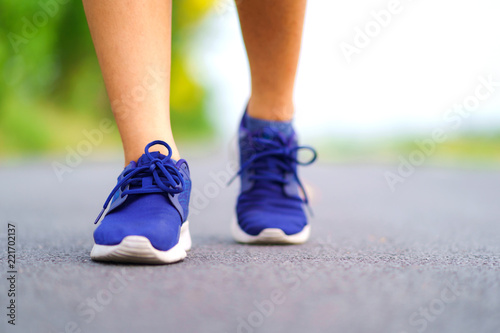 Woman legs walking in the park, Female runner running on the road outside