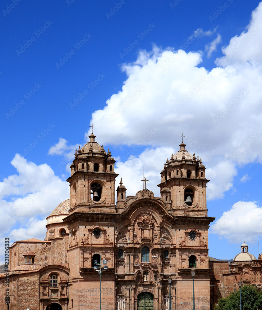 The Iglesia de la Compania de Jesus Church against Sunny Vivid Blue Sky of Cusco, Peru, South America