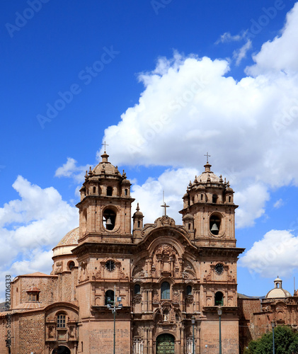 The Iglesia de la Compania de Jesus Church against Sunny Vivid Blue Sky of Cusco, Peru, South America © jobi_pro