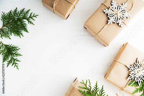 Christmas and New Year holiday background. Xmas greeting card. Christmas gifts on white wooden background top view. Flat lay