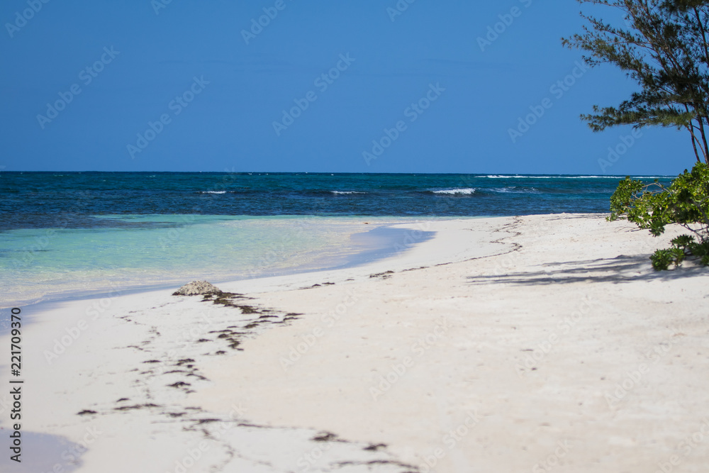 White sand beach and blue water in Falmouth Jamaica
