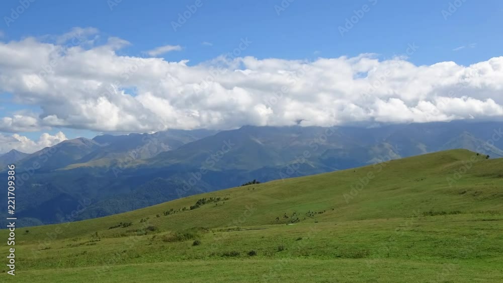 Time lapse mountains scenes in national park Dombai, Caucasus, Russia, Europe. Summer landscape, sunshine weather, blue sky and sunny day Time lapse mountains scenes in national park Dombai, Caucasus, Russia, Europe. Summer landscape, sunshine weather, blue sky and sunny day
