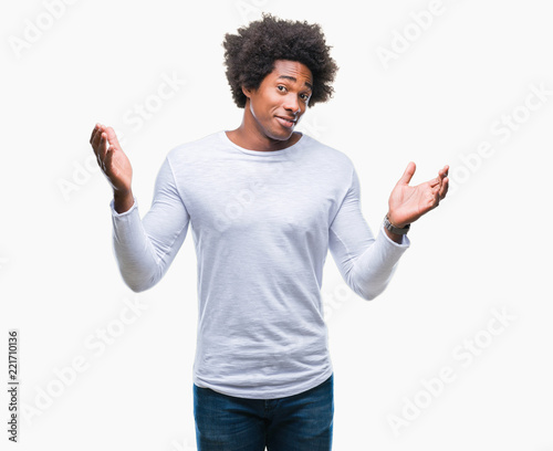 Afro american man over isolated background clueless and confused expression with arms and hands raised. Doubt concept.