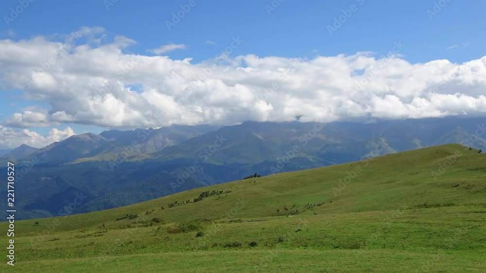 Time lapse mountains scenes in national park Dombai, Caucasus, Russia, Europe. Summer landscape, sunshine weather, blue sky and sunny day Time lapse mountains scenes in national park Dombai, Caucasus, Russia, Europe. Summer landscape, sunshine weather, blue sky and sunny day