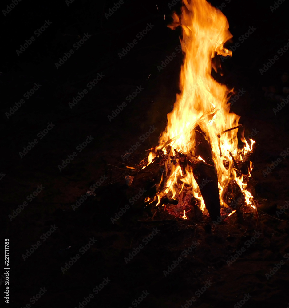 A nice photo of a bonfire at night, wood pieces burning in the field A nice photo of a bonfire at night, wood pieces burning in the field