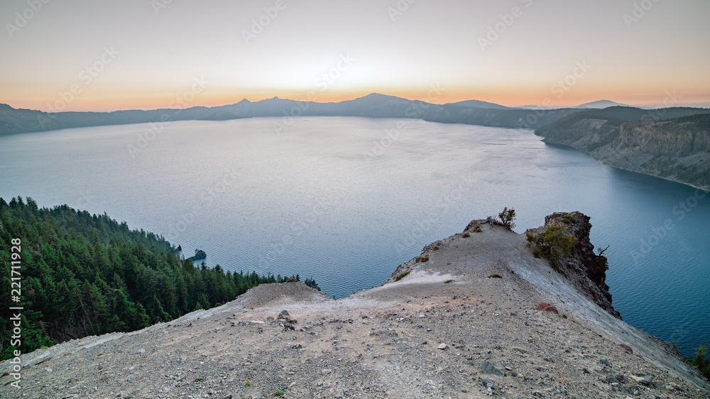 Panoramic view of the mountain lake - Crater Lake, Oregon. Wizard island on the horizon.