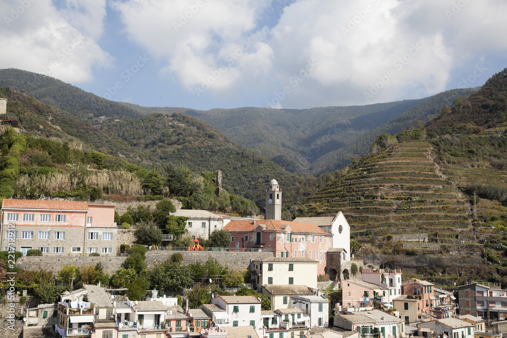 view of the town of Vernazza Italy and the surrounding mountains