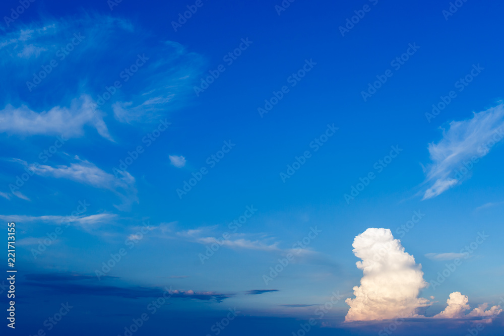 Large single cloud in a blue sky.