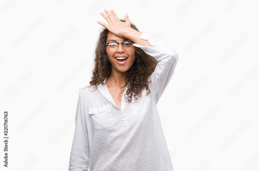 Beautiful young hispanic woman surprised with hand on head for mistake, remember error. Forgot, bad memory concept. Beautiful young hispanic woman surprised with hand on head for mistake, remember error. Forgot, bad memory concept.