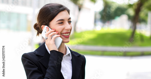 Portrait of a young woman talking on the phone