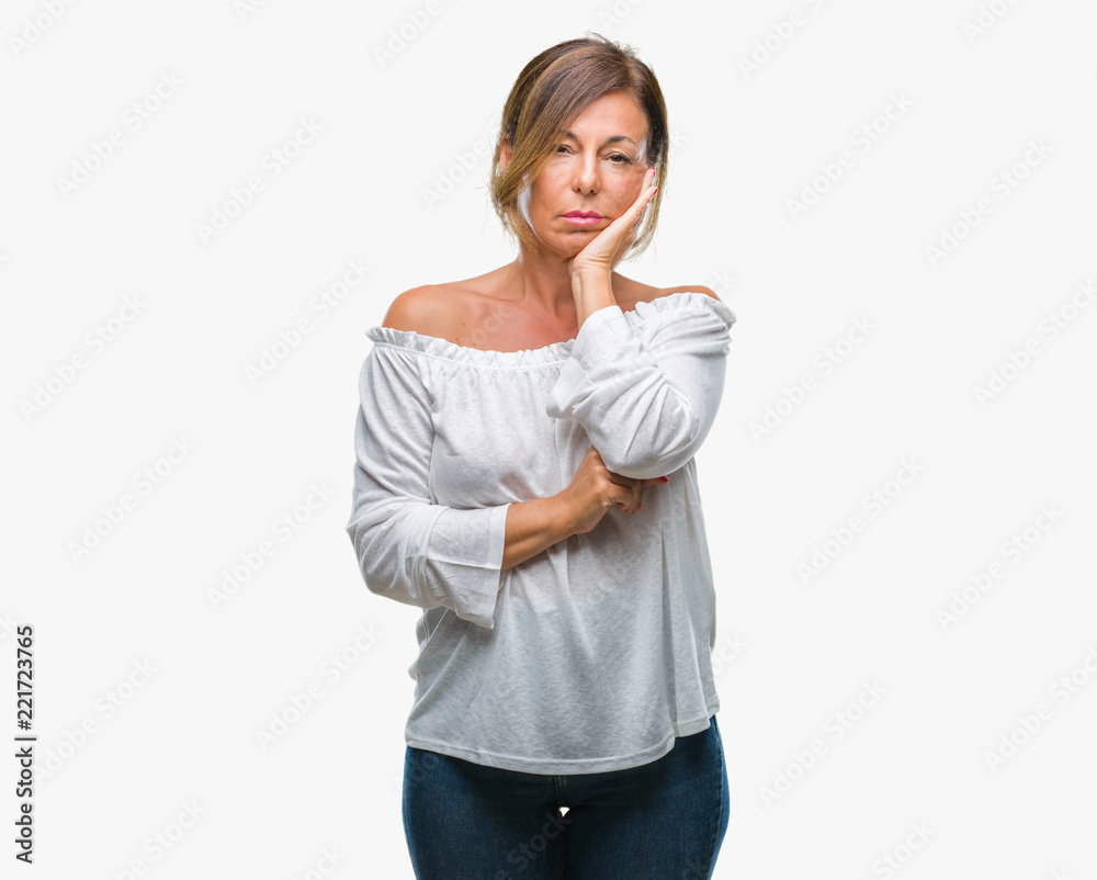 Middle age senior hispanic woman over isolated background thinking looking tired and bored with depression problems with crossed arms. Middle age senior hispanic woman over isolated background thinking looking tired and bored with depression problems with crossed arms.