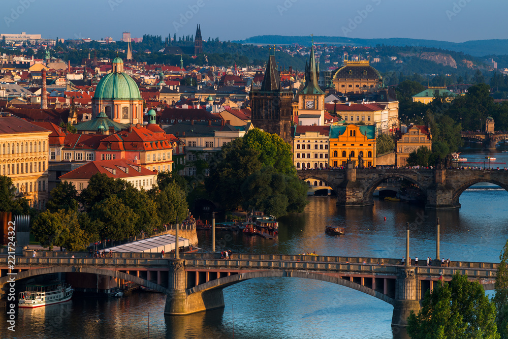 summer sunset aerial view of the Old Town pier architecture and Charles Bridge over Vltava river in Prague, Czech Republic