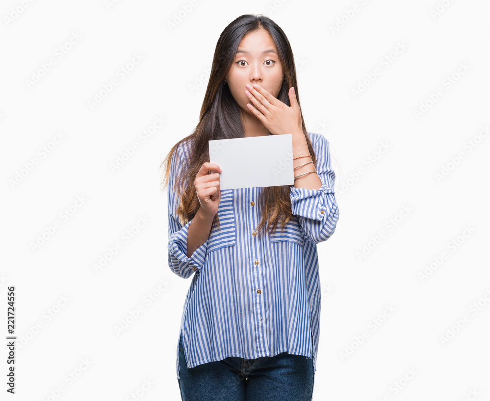 Young asian woman holding blank card over isolated background cover mouth with hand shocked with shame for mistake, expression of fear, scared in silence, secret concept Young asian woman holding blank card over isolated background cover mouth with hand shocked with shame for mistake, expression of fear, scared in silence, secret concept