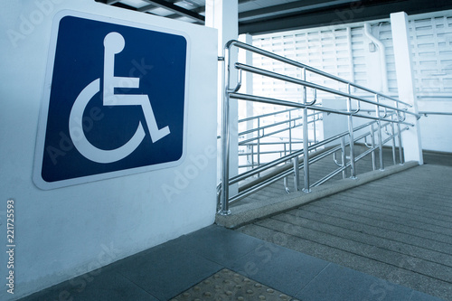 Print op canvas Concret ramp way with stainless steel handrail with disabled sign for support wheelchair disabled people