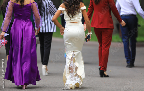 girl from behind in a long white dress