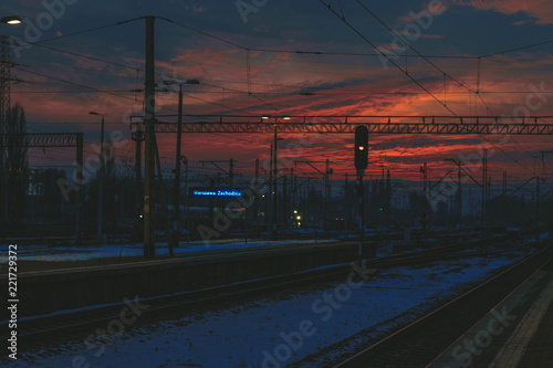 Naklejka Sunset at railroads