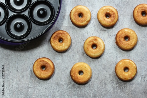 Homemade Mini Donuts with Dughnut maker on side, top view photo